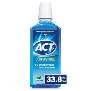 act restoring fluoride mouthwash 33.8 fl. oz. strengthens tooth enamel, cool mint