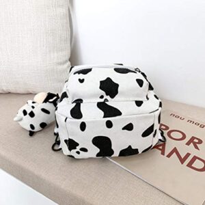 TENDYCOCO Cow Backpack with Plush Cow Pendant Canvas Cow Print Backpack Cow Print stuff Cow Gifts for Women Mini Backpack for Women