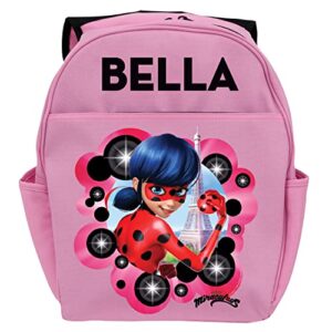 miraculous ladybug personalized backpack with custom name printed on pink book bag | zippered compartments and side water bottle pockets | youth size school bag