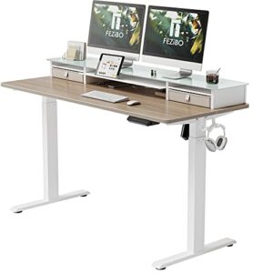 fezibo electric standing desk with glass top monitor stand,55 x 26 inch adjustable sit stand up table with double drawer, sit stand desk with storage shelf, white frame/light walnut top