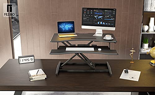 FEZIBO Standing Desk Converter Stand up Desk Riser, 34 inches Height Adjustable Ergonomic Tabletop Workstation Riser Fits Dual Monitors Black