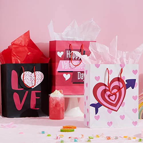 JOYIN 8 Pcs Valentines Day Gift Bags with Filling Paper in 4 Designs for Kids Party Favor Supplies Paper Wrapping Kraft Bags with Colorful Heart shaped Design