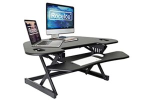 rocelco 46″ height adjustable corner standing desk converter, quick sit standup dual monitor riser, gas spring assist tabletop computer workstation, large keyboard tray, (r cadrb-46), black