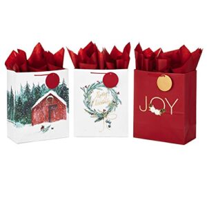 hallmark 13″ large christmas gift bag assortment with tissue paper (3 bags: “merry christmas” wreath, gold joy, snowy red barn) red, white, gold foil