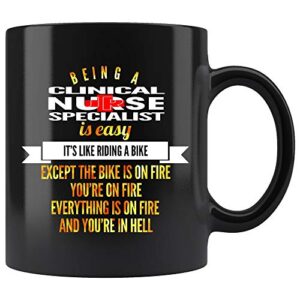 clinical nurse specialist coffee mug. being a clinical nurse specialist is easy like riding a bike except the bike is on fire you’re on fire and in hell funny gifts for women men 11 oz black