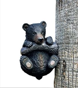 adorable black bear cub hanging on branch yard garden tree decoration 13.5″