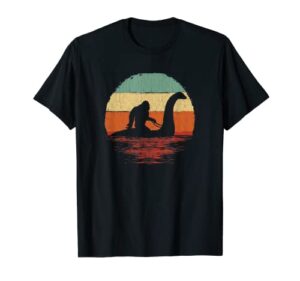 vintage funny bigfoot riding the loch ness monster t-shirt