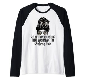 she overcame everything that was meant to destroy her raglan baseball tee