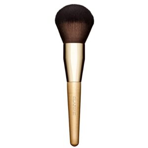 clarins powder brush | plush, domed brush | apply compact and loose powder with flawless, even results | ultra-soft synthetic fibers and sustainably sourced birch handle