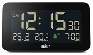 braun digital alarm clock with date, month and temperature displayed, negative lcd display, quick set, crescendo beep alarm in black, model bc10b.