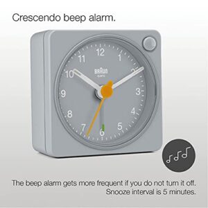 Braun Classic Travel Analogue Alarm Clock with Snooze and Light, Compact Size, Quiet Quartz Movement, Crescendo Beep Alarm in Grey, Model BC02XG