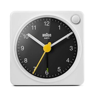 braun classic travel analogue alarm clock with snooze and light, compact size, quiet quartz movement, crescendo beep alarm in white and black, model bc02xwb.