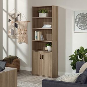 Sauder Beginnings Bookcase with Doors, L: 24.65" x W: 11.65" x H: 71.14", Summer Oak Finish