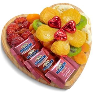 dried fruit and chocolate with ghirardelli on heart shaped bamboo tray for valentines day