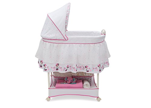 Delta Children Gliding Bedside Bassinet - Portable Crib with Lights, Sounds and Vibration, Disney Minnie Mouse Boutique