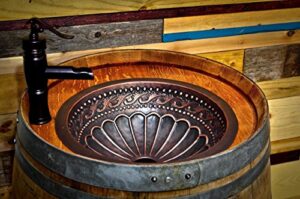 wine barrel copper sink vanity with hidden hinged door and antique waterfall faucet