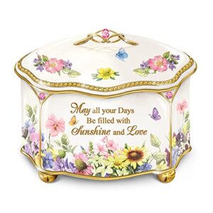 the bradford exchange a garden of love hand-glazed ivory-color music box adorned with nature art by marjolein bastin and features a scalloped-edge lid with 22k-gold accents