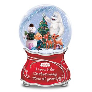 rudolph the red-nosed reindeer musical glitter globe featuring a joyful sentiment & silvery bas-relief accents on the base