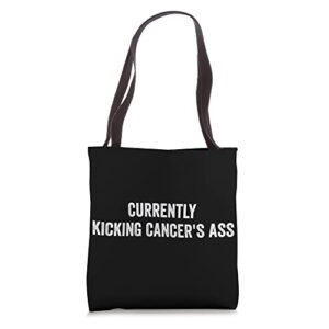 currently kicking cancers ass motivational tote bag