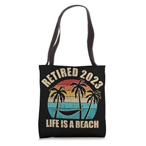 retired 2023 life is a beach vintage retirement tote bag