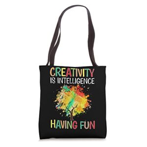 art teacher: creativity is intelligence having fun tote bag