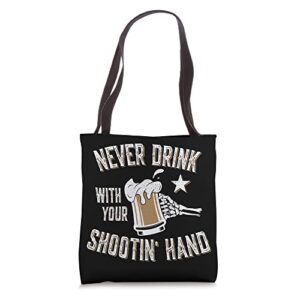 never drink with your shooting hand skeleton funny drinking tote bag