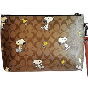 COACH Peanuts Carry All Pouch With Snoopy Woodstock Print