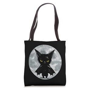 halloween cat and moon: grumpy black kitten in bat costume tote bag
