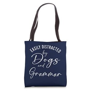 womens distracted by dogs and grammar funny graphic dog mom tote bag