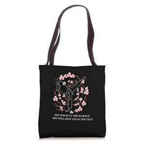she is beauty she is grace she will kick you in the face tote bag