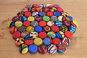 handcrafted african trivet made of recycled bottle caps wrap in kitenge material – handmade in rwanda – 10 inches, multicolored