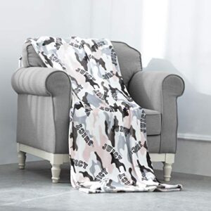 juicy couture – throw blanket | camouflage | plush and cozy | decorative blankets for sofas, chairs and beds| luxurious and soft | chic home décor | measures 50” x 70” | pink/grey/black