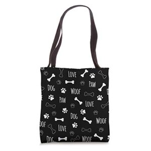 love dog woof bone and paw pattern in black background tote bag