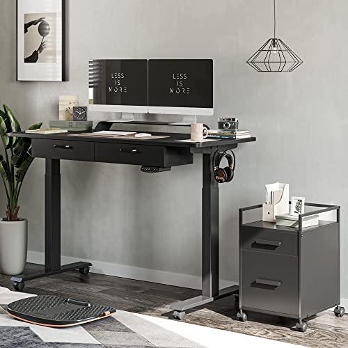 FEZIBO Adjustable Height Electric Standing Desk with Double Drawer, 55 x 24 Inches Stand Up Home Office Desk with Splice Tabletop, Black Frame/Black Top