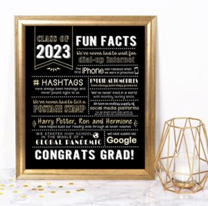 katie doodle – 2023 graduation decorations – class of 2023 decorations – great party centerpiece, card or class of 2023 gifts for her or him – 2023 fun facts sign [unframed], 8×10 inch, black and gold