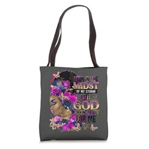 black girl in the midst of storm believe in god christian tote bag