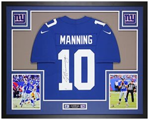 eli manning autographed blue new york jersey – beautifully matted and framed – hand signed by manning and certified authentic by fanatics – includes certificate of authenticity