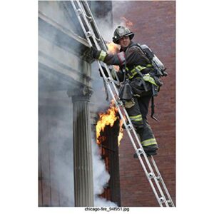 chicago fire – taylor kinney as kelly severide, climbing ladder from a burning building 8 inch by 10 inch photograph-bg