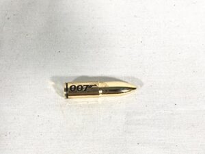 007 james bond, collector’s gold bullet paper weight