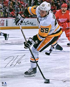 jake guentzel pittsburgh penguins autographed 16″ x 20″ white jersey shooting photograph – autographed nhl photos