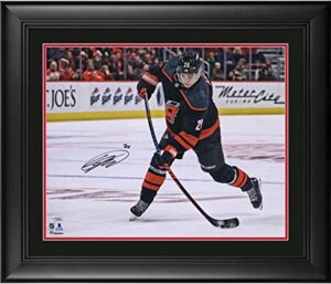 sebastian aho carolina hurricanes framed autographed 16″ x 20″ black alternate jersey shooting photograph – autographed nhl photos