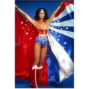 lynda carter 8 inch x 10 inch photograph wonder woman tv series (1975 – 1979) holding out cape w/both hands w/blue background pose 4 kn