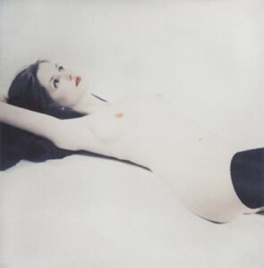 reclining nude with black stockings