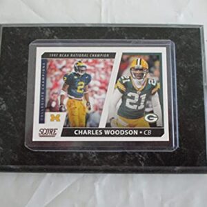 CHARLES WOODSON MICHIGAN STATE - GREEN BAY PACKERS 2021 NFL PANINI SCORE FOOTBALL"1997 NCAA NATIONAL CHAMPION - COLLEGIATE CHAMPIONS" PLAYER CARD MOUNTED ON A 4" X 6" BLACK MARBLE PLAQUE