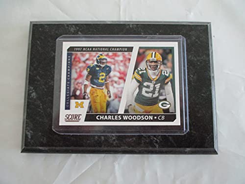 CHARLES WOODSON MICHIGAN STATE - GREEN BAY PACKERS 2021 NFL PANINI SCORE FOOTBALL"1997 NCAA NATIONAL CHAMPION - COLLEGIATE CHAMPIONS" PLAYER CARD MOUNTED ON A 4" X 6" BLACK MARBLE PLAQUE