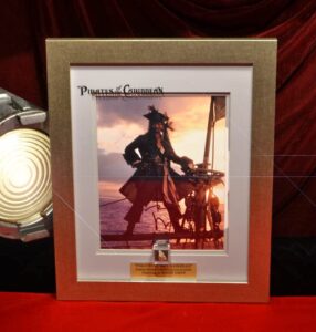 johnny depp signed pirates of caribbean photo, screen used prop gold nuggets & coin, watch, sand, blu ray