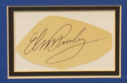 Elvis Presley autograph paper showing it's age. The 'King' of rock n' roll still reigns.