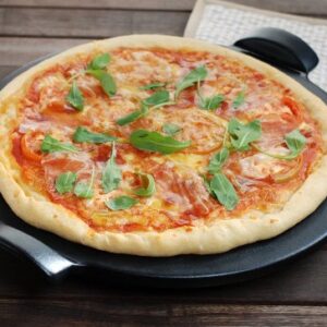 Emile Henry Made in France Flame Top Pizza Stone, Black. Perfect for Pizzas or Breads. In the Oven, On Top of the BBQ. Safe up to 750 degrees F. 100% Natural Clay, Glazed Surface. Easy to Clean.