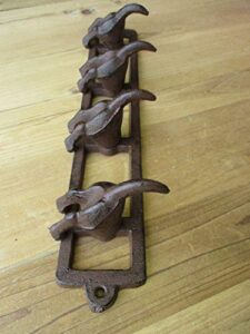 4 cast iron dog tail hooks on rack