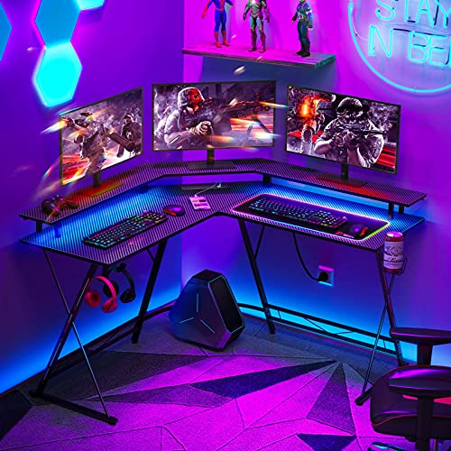 SEVEN WARRIOR L Shaped Gaming Desk with LED Lights & Power Outlets, 50.4” Computer Desk with Monitor Stand & Carbon Fiber Surface, Corner Desk with Cup Holder, Gaming Table with Hooks, Black